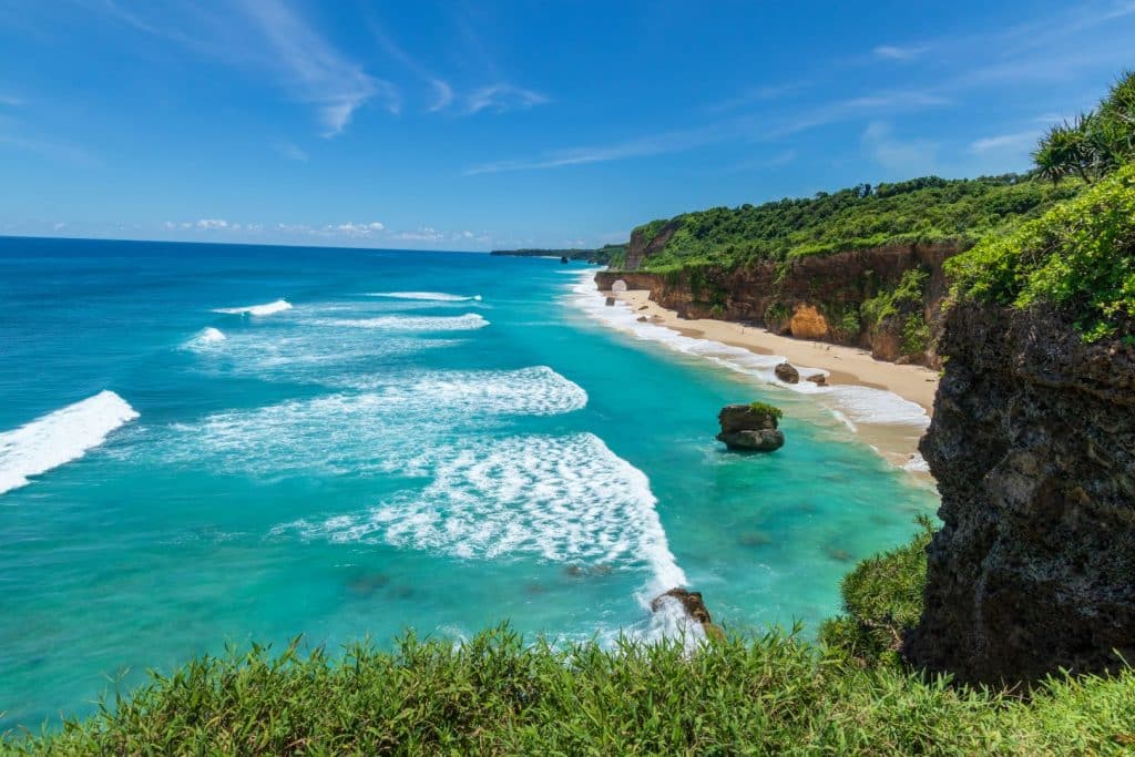 Aerial view of pristine turquoise coastline and white-sand beach in Sumba, Indonesia