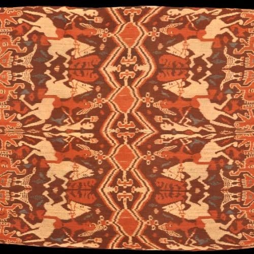 Traditional Sumba hinggi cloth with complex ancestral motifs and symmetrical layout.