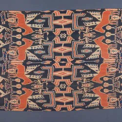 Sumba hinggi cloth with horse motifs and geometric borders in indigo and morinda dye.